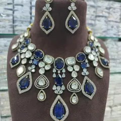 The same statement necklace design, but with deep sapphire blue stones. I can customize the stone color to your preference.