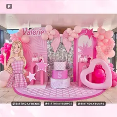 A spectacular Barbie-themed party with a checkered floor, multiple backdrops, and a huge heart-shaped balloon frame. The life-sized modern Barbie cutout and tiered cake plinths make this a truly show-stopping setup.