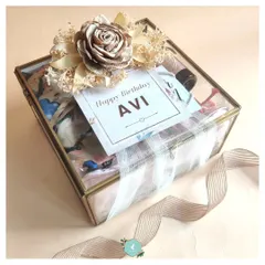 An elegant glass and brass display box used for a birthday hamper. This luxurious packaging turns the gift into a beautiful keepsake box.