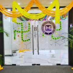 Here is another office entrance decorated for Diwali, using yellow and orange marigold garlands to create a simple and elegant festive look.