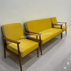 A vibrant mid-century modern sofa set, featuring a three-seater and two matching armchairs. I crafted this set from solid teak with a warm walnut finish and upholstered it in a bold yellow fabric, showing how customization can bring a pop of color and personality to your living room.