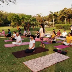 A snapshot of our yoga class in progress at the park. I provide guidance to ensure everyone is comfortable and getting the most out of their practice.