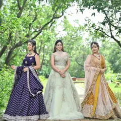 We have something for the entire bridal party. This photo shows the beautiful variety in our collection, from a modern reception gown to elegant lehengas for bridesmaids, ensuring everyone looks their best.