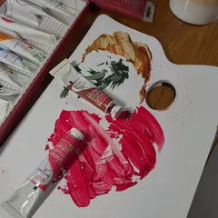 It's like a chemistry lab on my desk, trying to find the perfect red. Not too red, but red enough. You know what I mean, right?
