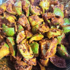 This is what my mango pickle looks like right after it's mixed. You can see the pieces of raw mango and the texture of the freshly ground spices.