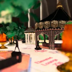 The miniature model showcases the placement of canopies and even tiny human figures to give a sense of scale. This helps my clients and me understand how the space will feel when it's full of guests.