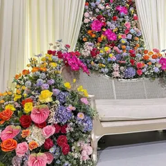 A side view of the magnificent floral cascade. You can see the depth and dimension we create by layering different types of flowers, from large orchids to delicate roses.