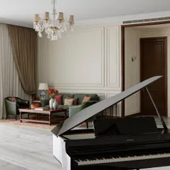 A film production office feels incomplete without music. Placing a baby grand piano in the heart of this lounge was an instinctive choice to make the space feel more like a home. It serves as a beautiful visual statement and a source of spontaneous creativity for jam sessions or quiet moments.