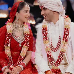 A quiet, shared smile between the bride and groom. In the midst of all the ceremonies and rituals, these are the moments of connection that truly matter. Parth and Jhanvi's easy chemistry is evident in this simple, beautiful shot.
