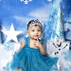 Another delightful shot from the Frozen session, capturing a curious and playful expression. The detailed backdrop and props create an immersive and enchanting scene for your baby's portrait.