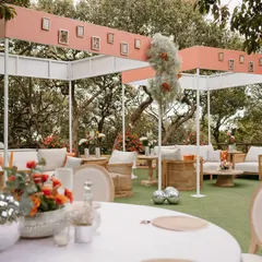A wide view of the inclusive ceremony layout, with comfortable lounge seating under a modern canopy. The design ensures guests feel connected to the ceremony.