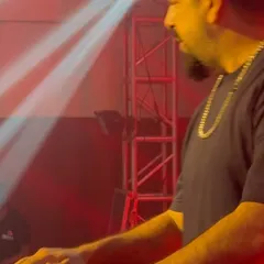 A close-up shot of me mixing during a high-energy college fest set.