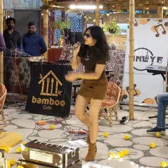 Performing an acoustic set at a cozy cafe event. This photo shows the intimate and casual setup, perfect for smaller venues and audiences who want to connect with the music.
