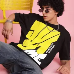 A close-up on a bold graphic tee from the 'Chic Street' campaign. My styling focused on making the apparel the hero, using minimal props like this yellow chair to complement the design.