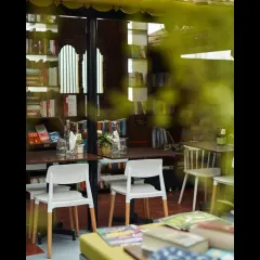 A glimpse into the cozy interior, where books and people come together. We used simple, honest materials and repurposed furniture to create a warm and unpretentious atmosphere.