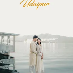 A serene portrait of a couple by the tranquil lakes of Udaipur. The soft light and calm water create a peaceful and romantic atmosphere for this destination pre-wedding shoot.