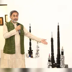 Here I am at my solo exhibition, presenting my 'Future City' sculpture series. These pieces are made from discarded heat sinks and other electronic parts, reimagined as futuristic skyscrapers to comment on modern urbanization and sustainability.