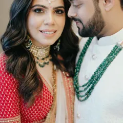 A warm, close up portrait of Bhavika and Anuj, their happy expressions and connection evident in this beautiful, candid moment.