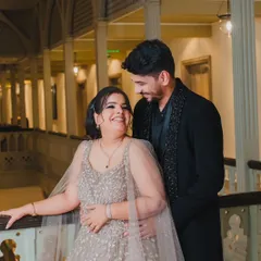 A candid moment of shared laughter and affection. These unposed, genuine interactions are what we strive to capture, showing the true personality of a couple's relationship.