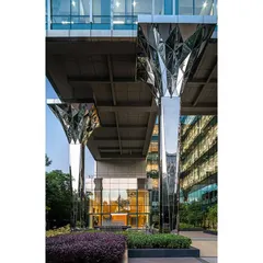 The entrance columns at the Stainless Steel Office were a radical intervention. We clad them in faceted stainless steel, creating a 'wow' factor that immediately introduces the company's core material.