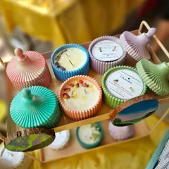 A colorful display of my lidded jar candles at a recent market stall. These are great for keeping your candle dust-free and preserving the fragrance. Each one is unique.