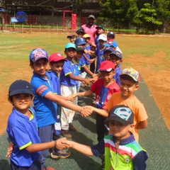 A moment of sportsmanship and respect as young cricketers shake hands. Our training emphasizes values just as much as it does skills.