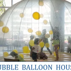 The Bubble Balloon House is a unique and fun activity for kids' parties, where they can play inside a giant transparent dome filled with balloons.