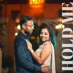 Using the warm, ambient lighting of a resort at night to create a romantic and elegant portrait. The soft glow on Akash and Priya's faces highlights their connection in this beautifully composed evening shot.