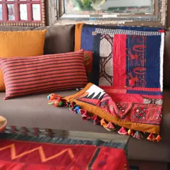 Another view of the scrap quilt, showing how the different patches of fabric, from Ajrakh prints to simple checks, come together to form a cohesive whole.