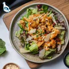Another view of our signature roasted cauliflower salad. The combination of textures and flavors makes it a standout dish that delights every palate.
