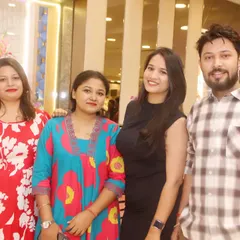 A group of friends and family smiling for the camera at a celebration.