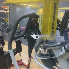 Sanitizing the cardio machines at Kitty's Muscle Planet. We ensure that all equipment is thoroughly cleaned between sessions.