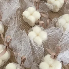 For a simple and elegant look, we can pack our bubble candles in these net potlis with a ribbon. It's a beautiful and affordable packaging option.