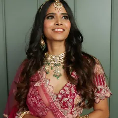 Looking up towards her future. This beautiful shot captures the dreamy essence of a bride on her wedding day, with flawless makeup and elegant jewelry.