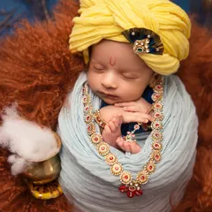 Another angle of the Little Krishna portrait, this time showing the pot of "makkhan" (butter). I love incorporating these small, symbolic props to make the theme feel complete.