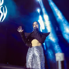 The artist Agsyworld, surrounded by stage smoke and dramatic blue spotlights. I excel at using challenging lighting conditions to create vibrant and memorable concert photos.