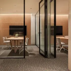 The flexible business centre at the Elevate Clubhouse, featuring a movable glass partition. This space was designed to adapt to the rise of remote work, offering a professional environment within a leisure setting.