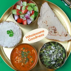 Wholesome goodness on a plate. This meal features a delicious paneer bhurji, a simple karela sabzi, soft jowar bhakri, rice, and a fresh kachumber salad.