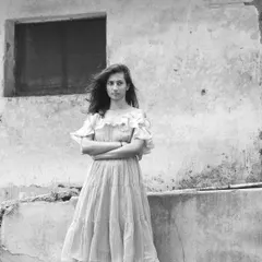 The same portrait in black and white, which adds a timeless and emotional depth to the image.