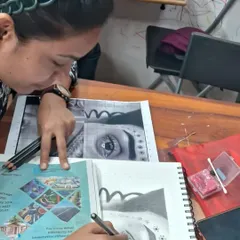 A student practices the grid method to create an accurate portrait drawing. This foundational technique is excellent for understanding proportion and is a key part of our General Art Foundation course.