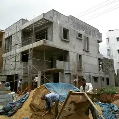 A typical day on site. This photo shows a residence in Uttarahalli during the structural phase, with the concrete frame and blockwork going up. I personally supervise every stage of construction.