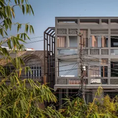The building's form is designed like a coconut: a hard shell to protect against pollution and wildlife, with a soft, welcoming interior. The grid motif allows sunlight and air to permeate the structure, creating a breathable and balanced living environment.