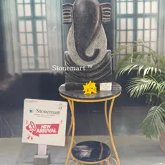 This is the black granite version of our modern abstract Ganesha sculpture. At 21 inches tall, its sleek design and dark stone make it a sophisticated and contemporary spiritual art piece for any home or garden.