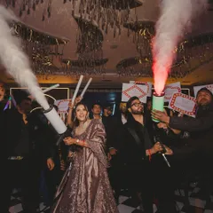 After the wedding comes the after-party. For this couple, we planned a masquerade night where they made a grand entrance with CO2 guns, kicking off an unforgettable night of mystery and music.