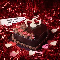 Our heart-shaped Dutch Truffle cake is the perfect way to express your love. Featuring rich chocolate ganache, delicate piping, and elegant white chocolate hearts, it's a classic choice for Valentine's Day or any romantic occasion.