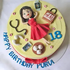An 18th birthday cake for a girl in a red dress, surrounded by all her favorite things: her phone, momos, a stethoscope, and shopping bags.