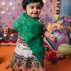 Look at that happy dance. This little girl is full of energy and excitement for the Navratri festivities.