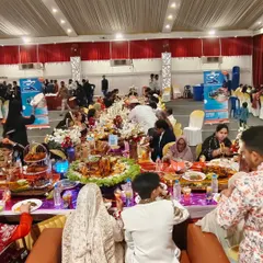 A view from the main sofa where the bride and groom sit, looking out at their guests enjoying the feast. We ensure the VIP table is the center of attention, with lavish food displays and impeccable service.
