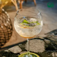 Raise a glass to good times. This signature cocktail, with its unique garnish, is a perfect example of the craft and creativity my bar team puts into every drink.