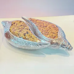 An elegant and traditional gift of health and prosperity. These ornate, shell-shaped silver bowls are filled with premium walnuts and almonds.